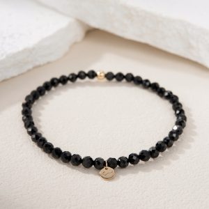 Pulsera de con espinela negra natural con placa redonda de Oro 14K